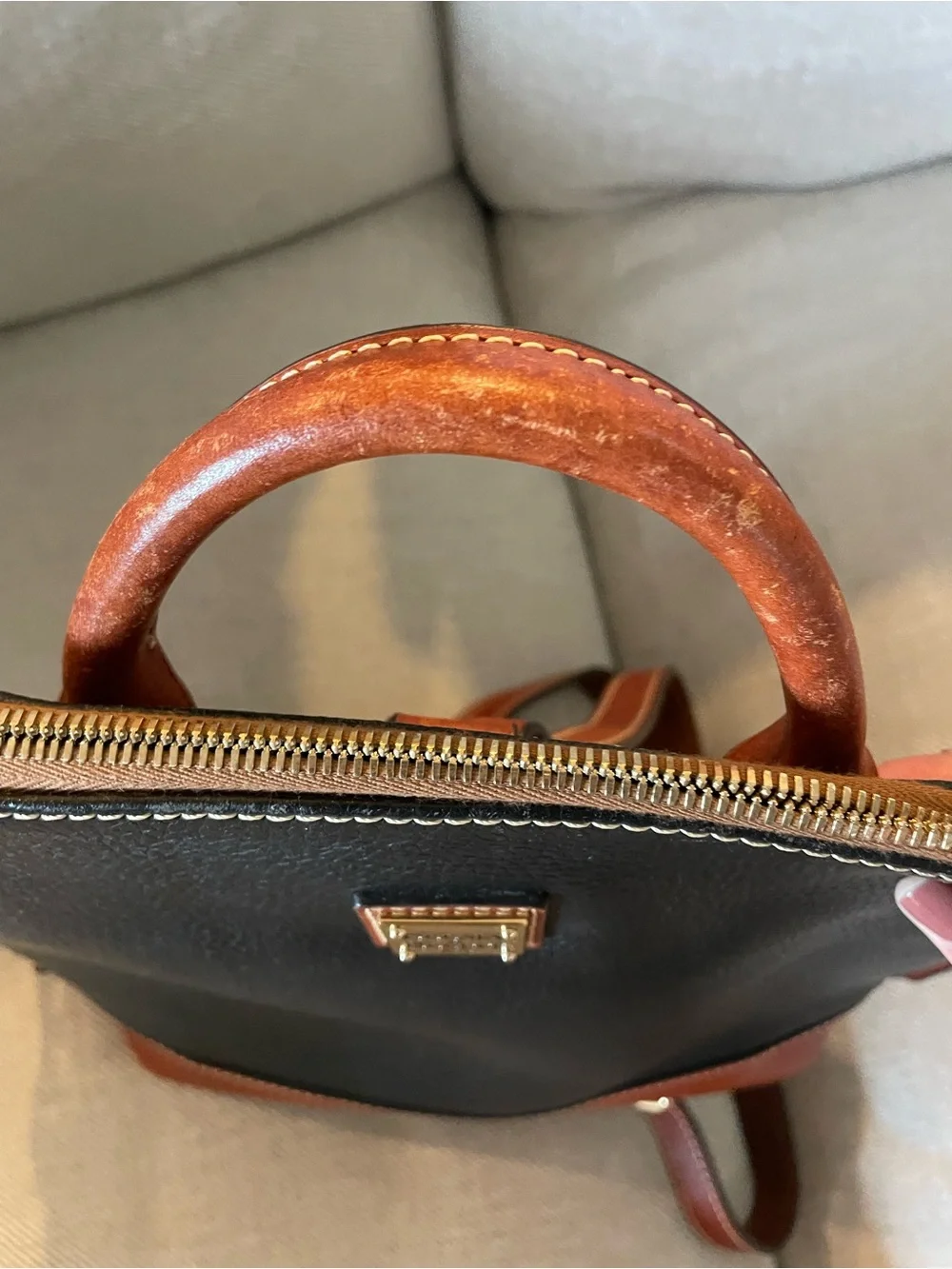 Dooney & Bourke Black with Brown Trim Leather Backpack